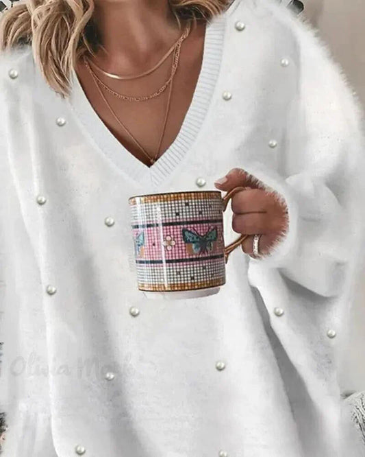 Kin | Langärmeliges flauschiges Top mit Perlen