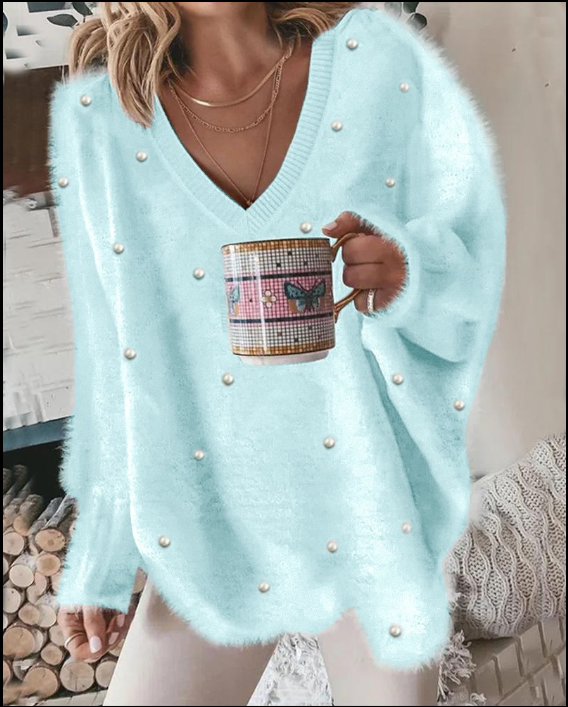 Kin | Langärmeliges flauschiges Top mit Perlen