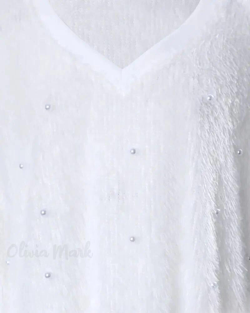 Kin | Langärmeliges flauschiges Top mit Perlen